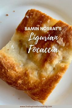 a piece of food on a white plate with the words samini nosrat's ligurian focaccia