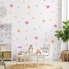 a child's playroom with pink and blue stars on the wall