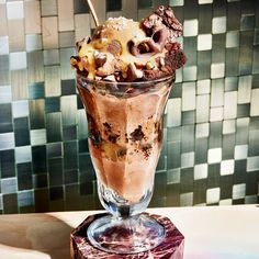 an ice cream sundae in a glass on a table