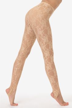 Try subbing out your patterned tights for these durable, floral lace leggings for a similar look to hosiery. These stirrup leggings are made of a nylon/spandex blend to last and make for easy layering. Runs true to size. Made in Los Angeles, Calif. Our experienced sewers earn up to $25 an hour and no less than $16; additionally workers have healthcare benefits for less than $15 per week, a 401k plan, paid sick days, subsidized bus passes and favorable overtime benefits | Floral Lace Stirrup Legg Perfect Leggings Lace, Spring Lace Stretch Tights, Spring Lace Tights, Elegant Lace Trim Tight Tights, Fitted Lace Thigh-high Tights, Amber Core, Patterned Hosiery, Stirrup Leggings, Lace Leggings