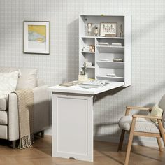 a living room with a couch, chair and book shelf on the wall next to it