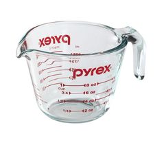 a glass measuring cup filled with liquid