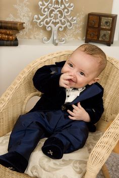 "A gentleman suit with elegant frock-coat, in an ivory and lovely navy blue combination, is such a perfect choice for little boys, who later will become handsome men. The details make from this \"Grandma's chest\" Collection occasion suit a real heirloom. Please measure the little one prior to ordering, to be sure the suit fits him. The measurements that you need to take are. Height Chest Circumference Waist Circumference Hips Circumference Suit components: trousers with belt, shirt with bow and velvet frock-coat. Colors: ivory and navy blue. Composition: cotton/rayon velvet and shantung silk. Please check our SIZE CHART and cleaning instructions at \"Policies\" section!" Elegant Royal Blue Three-piece Suit For Semi-formal Occasions, Classic Royal Blue Three-piece Suit For Formal Occasions, Blue Tuxedo Style Three-piece Suit For Wedding, Royal Blue Suit For Wedding, Royal Blue Formal Suits, Classic Royal Blue Wedding Suits, Elegant Navy Tuxedo, Royal Blue Formal Sets, Royal Blue Three-piece Suit For Groom