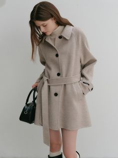 This is a minimal and modern half coat by LOOKAST that is made out of high quality and sturdy material. With distinctive mood of the design and comfortable wear, you can style it for your stylish and modern daily outfit.- Adjustable belt included for various styling- Color tape detail in the lining- Ox horn buttons finishing for high quality Short Wool Coat Women, Chic Wool Coat With Notch Lapel And Double-breasted Button, Chic Wool Coat With Double-breasted Button And Notch Lapel, Chic Wool Coat With Double-breasted Button Fastening, Wool Pea Coat With Double-breasted Button Fastening, Casual Long Sleeve Wool Coat With Double-breasted Fastening, Coat Outfit, W Concept, Wool Handmade