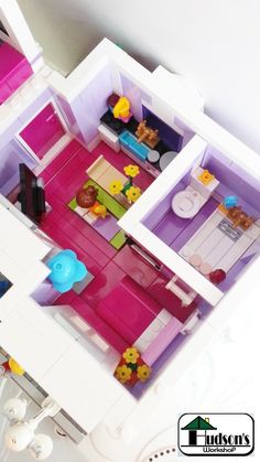 an overhead view of a dollhouse with furniture and accessories