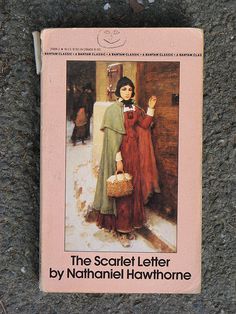 a book about the scariot letter by nathani hawthornee is laying on the ground