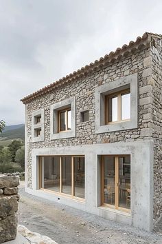 a house made out of stone with windows