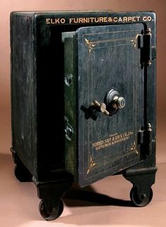 an old fashioned furniture and carpet co box on wheels with the door open to reveal it's contents