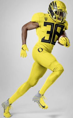 a man in a yellow uniform holding a football