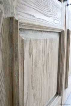 a close up view of a wooden cabinet door