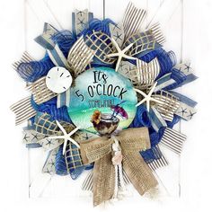 a blue and white wreath with an image of a bird on it