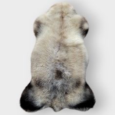 an animal's fur is shown in the shape of a head on a white background