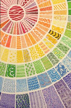 an image of a rainbow wheel made out of many different colored papers with numbers on it