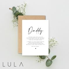 a card with the words daddy written in cursive writing on it next to some flowers