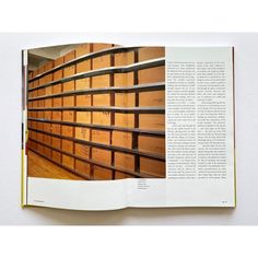 an open book with lots of drawers in it