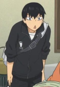 an anime character with his mouth open standing in front of a computer screen and looking at the camera