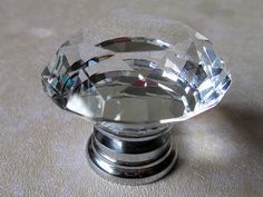 a clear glass knob on top of a table