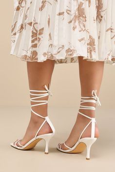 Make an entrance unlike any other with a fabulous look like the Lulus Lawrance White Lace-Up High Heel Sandals! Smooth faux leather shapes these trendy lil' heels that feature a classic square-toe footbed, a network of slender straps that create a peep-toe upper, and matching straps that weave through a supportive heel strap to wrap and tie above the ankle. 3. 25" wrapped stiletto heel. Cushioned insole. Rubber sole has nonskid markings. Man made materials. Imported. Lulus | Lawrance White Lace- Wedding Guest Ideas, Guest Ideas, Goddess Costume, Square Toe Shoes, Lace Up High Heels, Sandals Strappy, Sandal Heels, Lace Up Sandals, Heel Sandal