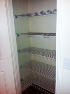 an empty walk in closet with no shelves