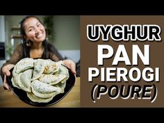 a woman holding a plate with food on it and the words uyghur pan pie