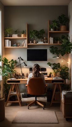 a woman sitting at a desk in front of a window with potted plants on it