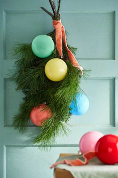 the door is decorated with balloons and greenery for an easter egg hunt or springtime celebration