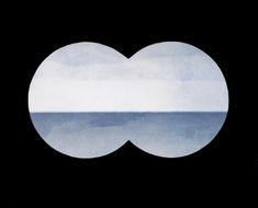 an image of the ocean through two circles