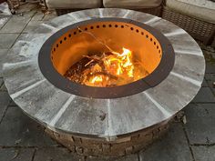 a fire pit sitting on top of a stone patio