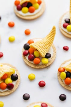 cookies with candy cornucopies on them are arranged in the shape of an elf's hat