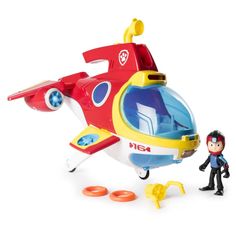 a toy helicopter with a small figure next to it