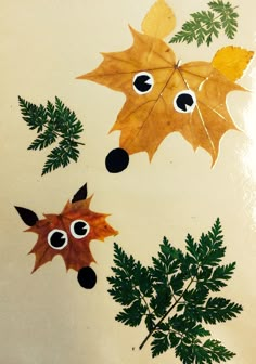 two leaves with googly eyes on them