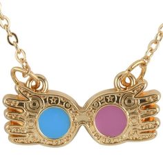 a necklace with two different colored glasses on it's sides and gold chains around the edges