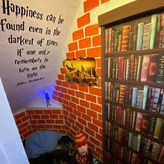 there is a book shelf with books on it and a sign above it that says happiness can be found even in the darkest of times if one