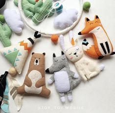 a group of stuffed animals hanging from a string