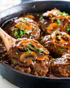 meatballs with mushrooms and gravy in a skillet