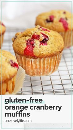 gluten - free orange cranberry muffins on a cooling rack