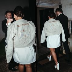 two people in suits and white shoes are walking towards the door to an old building