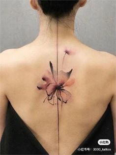 the back of a woman's neck with flowers painted on her body and behind it