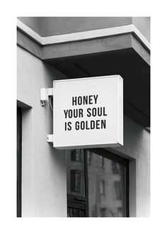 a sign on the side of a building that says, honey your soul is golden