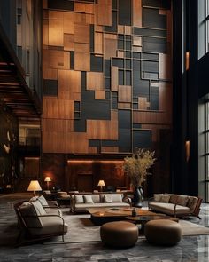 a living room with couches and tables in front of a large wooden paneled wall