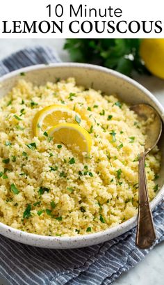 lemon couscous in a white bowl with spoons and parsley on the side