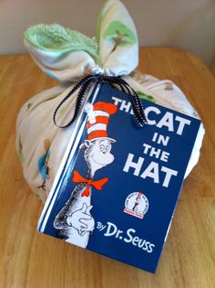 the cat in the hat book is wrapped up and ready to be used as a gift