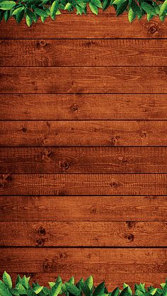 a wooden background with green leaves on the top and bottom corner, as well as an empty space for text or image