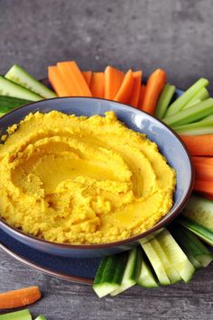 hummus with carrots, celery and celery sticks on the side