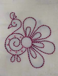 a piece of cloth that has been stitched into the shape of a flower on it