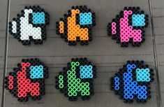 four different types of perler beads sitting on top of a table