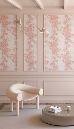 a living room with pink wallpaper and a white chair in front of a round coffee table