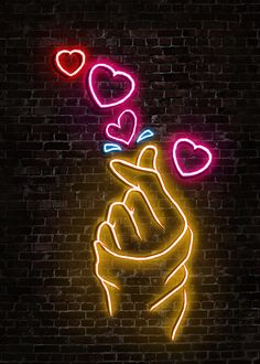 a neon sign that has hearts coming out of it on a brick wall in the dark