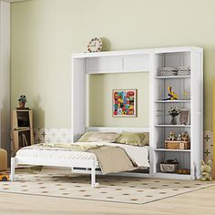 a white bed sitting next to a book shelf in a bedroom