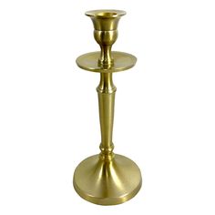 a gold candle holder on a white background